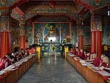 
Pokhara Karma Dubgyu Chokhorling Monastery - Monks In The Main Prayer Hall With Gilded Shakyamuni Buddha Statue

